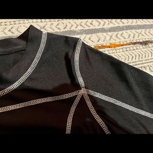 Tight Black top from urban outfitters. Spandex material and tight fitting.